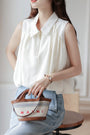 Chic Ivory Sleeveless Blouse - Masion Chérie