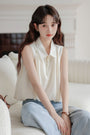 Chic Ivory Sleeveless Blouse - Masion Chérie