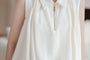 Chic Ivory Sleeveless Blouse - Masion Chérie